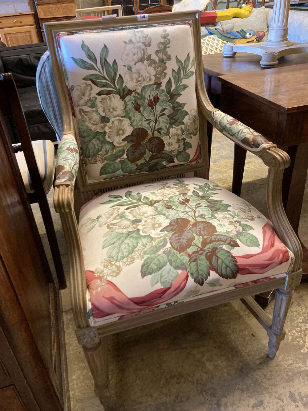 Two Louis XVI style cream painted carved wood fauteuils